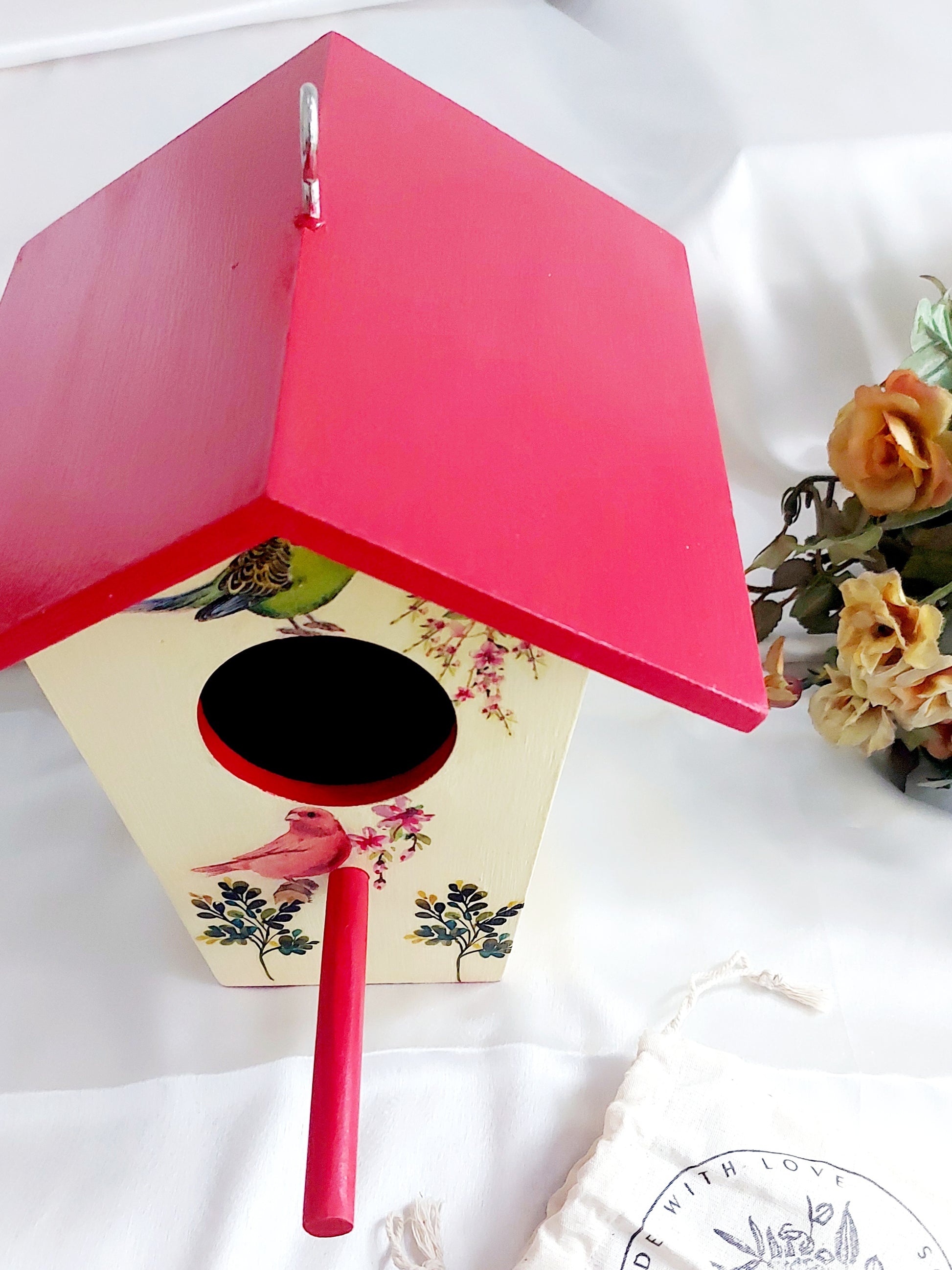 Bird house in red and yellow